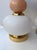 Pair of table or bedside lamps in brass, pink murano glass with white murano glass bulb textured globe shades....