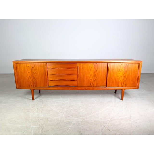 We are offering a beautiful teak sideboard by Aco Møbler from the 1960s for sale. Designed by Gunni Omann, it impresses...