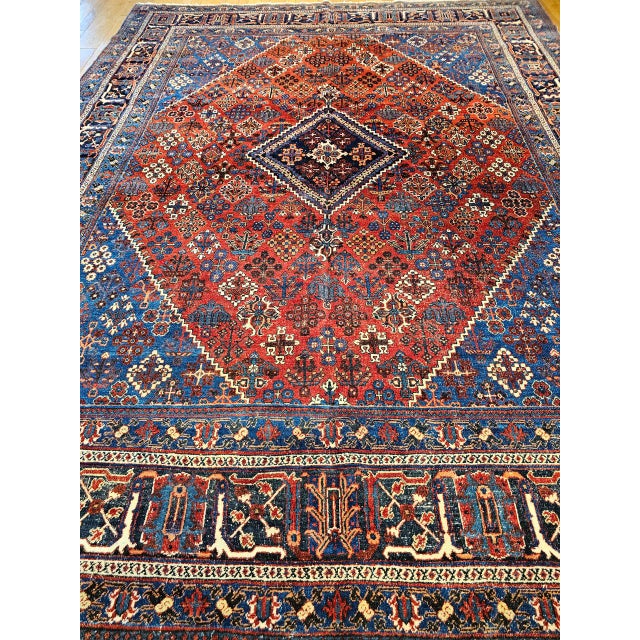 This exquisite early 20th-century Persian Kashan Joshegan rug, handwoven in Iran circa the early 1900s. Rendered in a...
