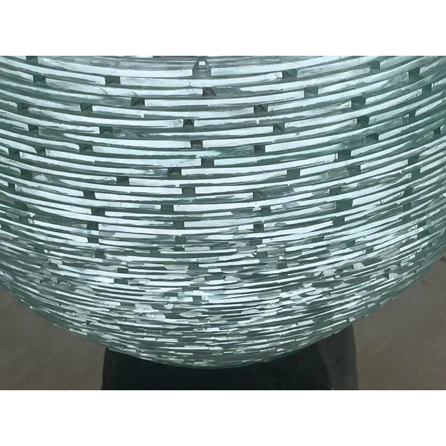 Gundi Stacked Glass Shard Planter Sculpture Bowl Measures: 18.5" wide x 13.5" tall Gundi is a glass artist who was born in...