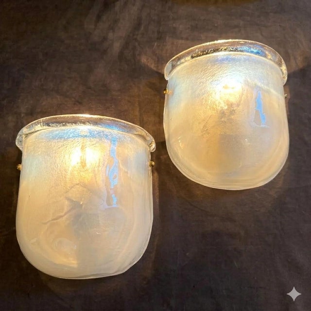 Two brass and murano glass wall sconces designed and handcrafted in Italy in the Nineties in the manner of Barovier, fully...