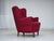 1960s, Danish armchair. Red furniture wool, beech wood legs with brass plugs, brass springs in the seat. The chair was...