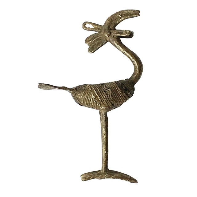 A Lobi bronze of a Bird ; the bird is appreciated for its protective powers and is considered a powerful amulet amongst...
