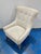 Stylish Modern Wing Chair. Nubby Cream Fabric, wood legs. Showroom floor sample.
