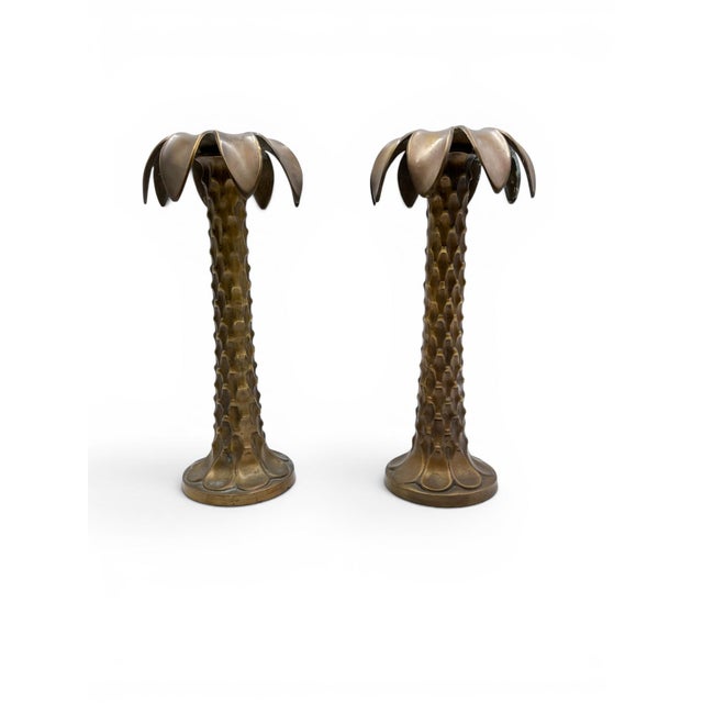 This pair of vintage solid brass palm tree candlesticks captures the glamour and relaxed elegance of classic Palm Beach...