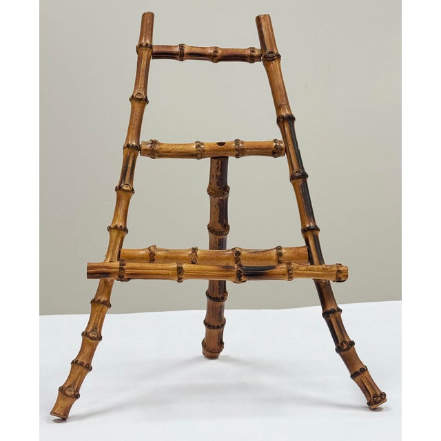 Large vintage richly colored burnt tortoise finish bamboo table easel. Chain link holds for support. Sturdy. Natural age...