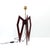 Vintage table lamp base with a sculptural, tripod base in mahogany-brown stained wood, both graphic and architectural. The...