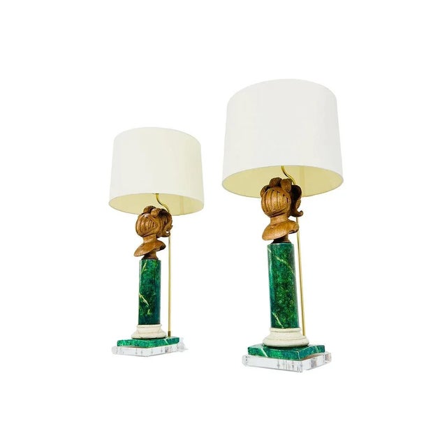 Pair of French neoclassical faux marble table lamps with carved knight heads and lucite bases. Custom made by Jan Showers....