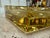 Sculptural Italian ashtray crafted from thick yellow Murano glass, featuring a square geometric form with a deeply...