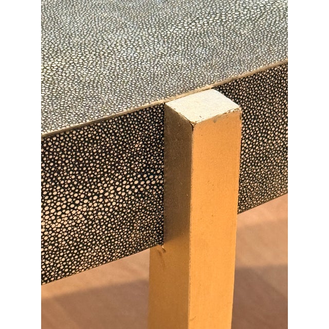 Lightly used and unmarked. From listing: The sculptural shape of this coffee table is complemented by the oval, faux...