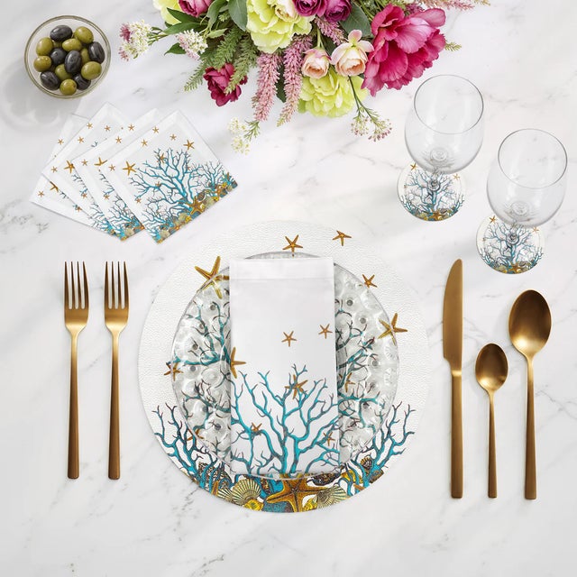 Let the whimsy of the sea wander gracefully into your table with our Coral Reef Vegan Leather Round Pebble Placemat....