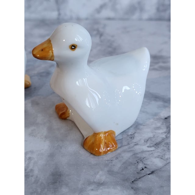 Charming pair of white ceramic duck napkin rings with adorable detailing. The original made in Taiwan sticker is on the...