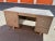 Vintage art metal desk from wells Fargo bank in original condition has storage shelf and drawers some scuffs and marks.