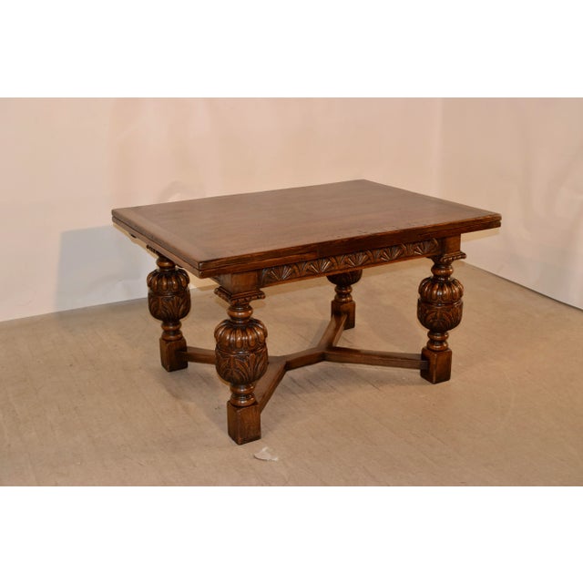 About Late 19th century oak table by the very well-known Titchmarsh and Goodwin Company in Ipswich. The top is banded and...