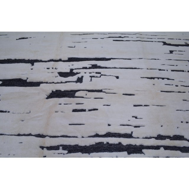 Hand-knotted with care using traditional rug-making techniques, this wool rug blends timeless craftsmanship with a modern...