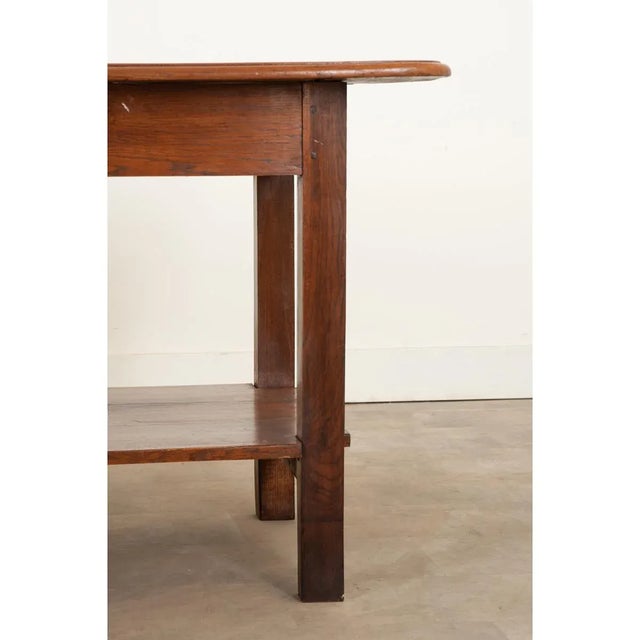 Dimensions: 34 ⅜” H x 69 ½” W x 38 ½” D This stunning French 19th century work table/small drapery table from Burgundy,...