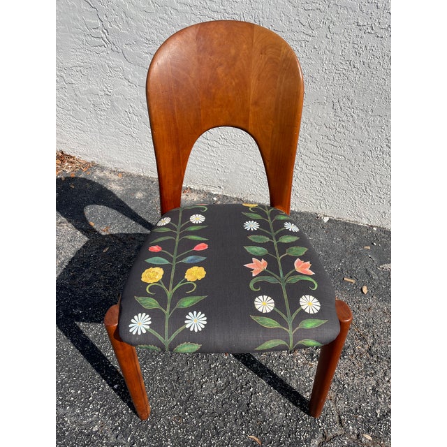 A beautifully crafted Danish mid-century modern chair by Koefoeds Hornslet, featuring a sculptural curved backrest with an...