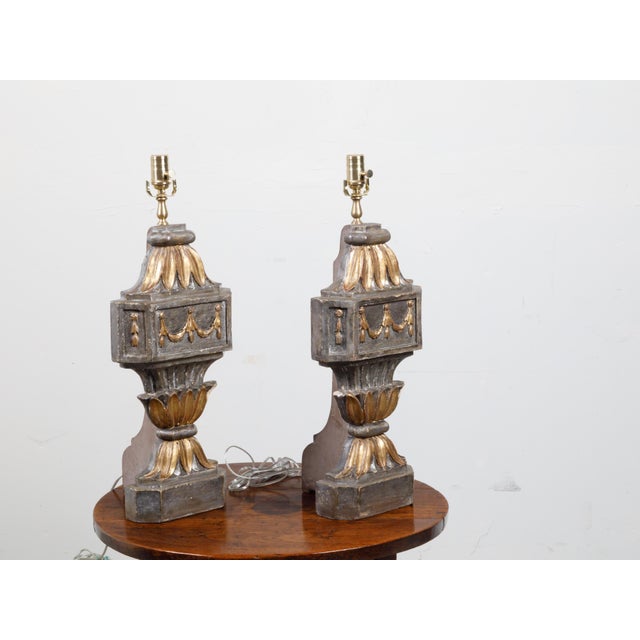 A pair of French carved and gilt wooden fragments from the 18th century, made into table lamps. Created in France during...