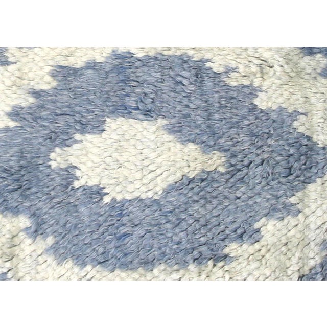 Contemporary Egyptian Tulu Rug. Hand woven in an Ikat design with wool on cotton foundation in the Nile delta region of...