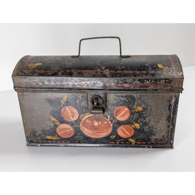 We are selling this well painted American primitive Toleware box. This tin box had colorful decoration and now has a...