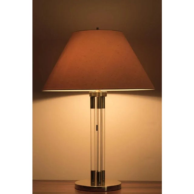 Beautiful vintage set of 2 table lamps with a brass and acrylic glass base, large model. The lamps have some traces of use...