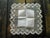 This delicate handkerchief is a refined example of early 20th-century lingerie, notable for its handcrafted quality....