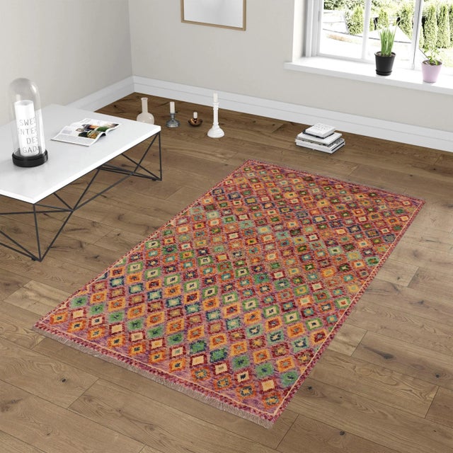 A mesmerizing addition to any decor, this exhilarating hand-knotted rug featuring exquisite coloration in an intricate...