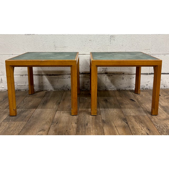 This is a gorgeous pair of vintage Tommi Parzinger for Charak green leather top end tables or side tables. They feature...