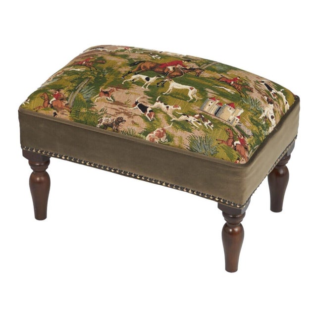 Meticulously handcrafted in the United Kingdom, this upholstered stool boasts classic studding and hand-polished solid...