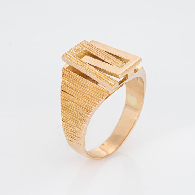 Stylish vintage square band crafted in 14 karat yellow gold (circa 1970s). The distinct textured square band makes a great...