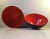 This pair of orange enameled-steel Eternit Krenit bowls was designed by Herbert Krenchel and manufactured by Torben Ørskov...
