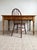 This antique, c. late 1800s English primitive pine table is a remarkable example of Victorian period craftsmanship,...