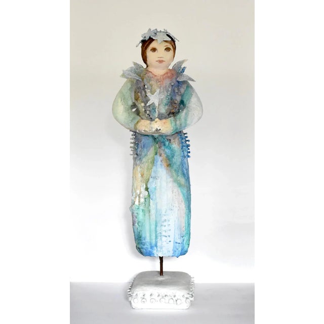 An original sculpture signed by Jacque Tatum (1926-2011) of a fairy in shades of blue. Plaster over mixed substances. The...