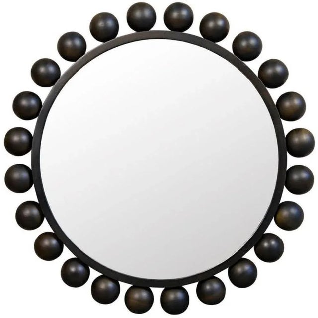 Circles on circles on circles, this round wall mirror reflects the sophistication of the home in which it resides. Crafted...