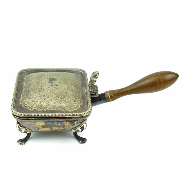 Add a touch of nostalgia and elegance to your home with this exquisite English silver-plated crumb catcher, also known as...