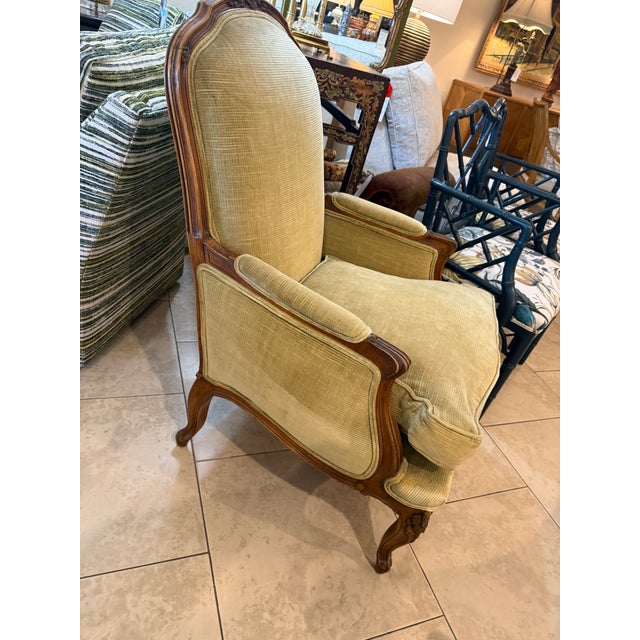 Beautiful Late Nineteenth Century Hand Carved Walnut Bergere uoholstered in Green Velvet, a large and very comfortable arm...