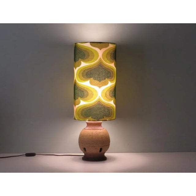 Lamp base from Massive Belgium made of unglazed natural earthenware with 5 rectangular recesses. The lampshade is made to...