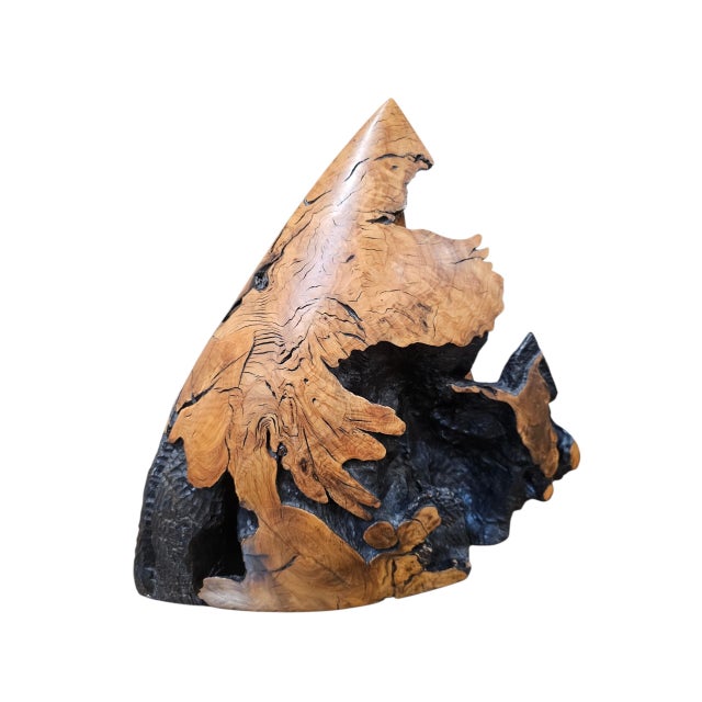 An extraordinary signed and dated 1990 wood sculpture, showcasing the remarkable beauty of natural wood transformed into...