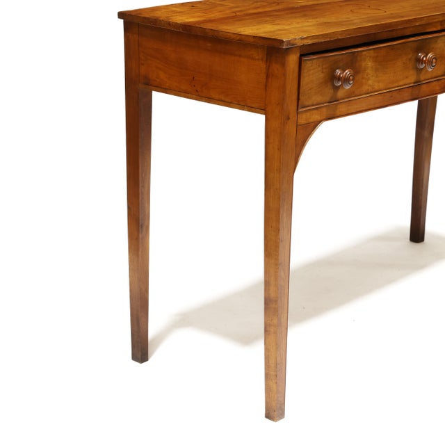 A refined mid-19th century Italianate walnut server featuring a beautifully understated silhouette and warm, richly...