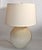 1950s textured cream-colored ceramic table lamp with a bulbous base attributed to Lotte and Gunnar Bostlund and comes with...