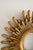 This vintage sunburst wall mirror embodies the glamour of Mid-Century Modern and Hollywood Regency design. Crafted in...