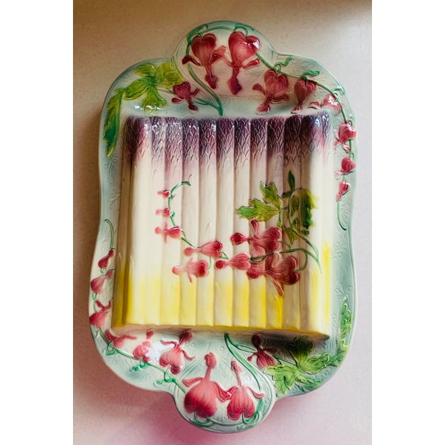 Beautiful French Majolica asparagus serving platter made by St Clement, France. Features red bleeding heart flowers...