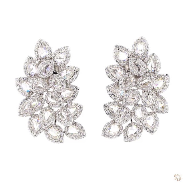 These estate earrings from our contemporary estate collection centers on a 3.97-carat diamond in a rose cut, prized for...