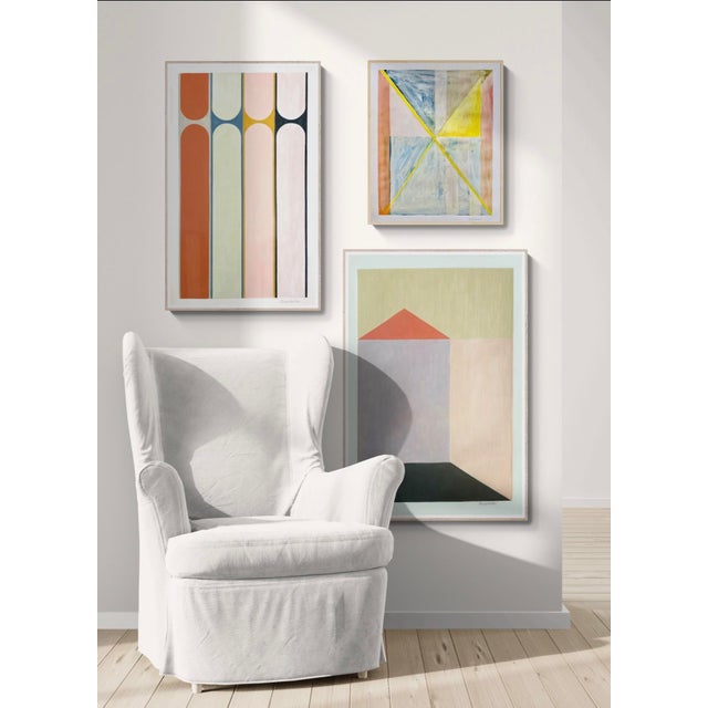 This piece features a row of colorful columns of opposing shapes made from paint and color pencil on paper. Colors include...