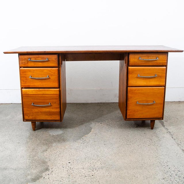 Rare and beautiful solid walnut floating fully finished office desk. Comes with 6 compact drawers each with silver modern...