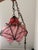 Vintage mid-20th-century Venetian Murano hand-blown caged glass pendant light featuring pink and white latticinio striped...
