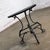 Handsome vintage Art Deco to Art Nouveau Italianate demilune table composed of a black painted hand wrought iron base with...