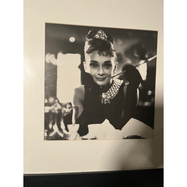 This is a reproduction print of the iconic shot of Miss Hepburn from the popular movie: “Breakfast at Tiffany’s” in 1961,...