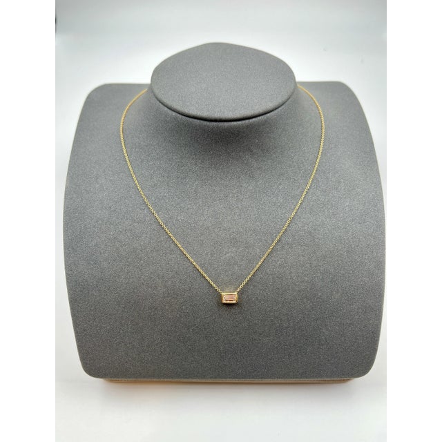 This beautiful diamond necklace is a great piece to start your jewelry collection. Encased in 14k yellow gold, the diamond...