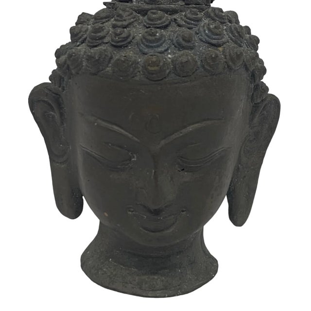 Early 20th Century Thai Patinated Bronze Buddha Head Sculpture. This vintage patinated bronze Buddha head statue sculpture...